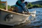 An angler nets a fish on the Gunnison River.